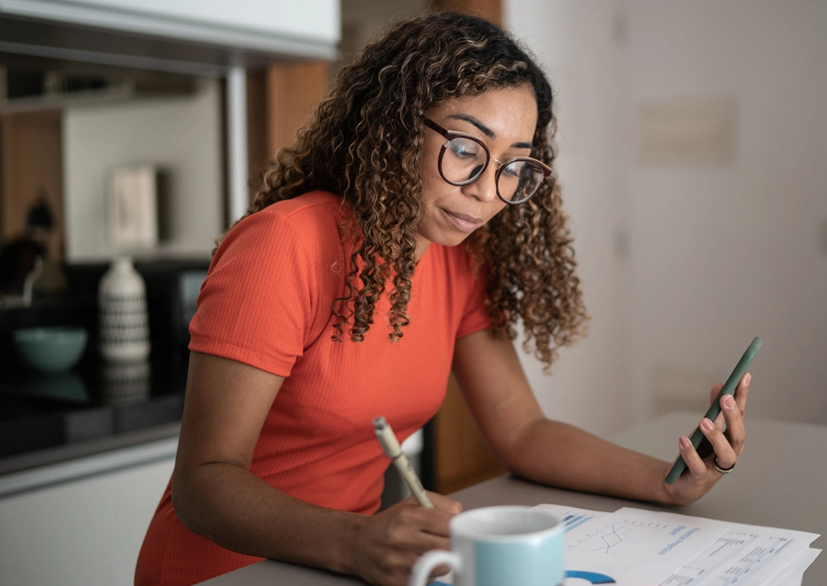 Person using a phone to get personalized guidance for building credit.
