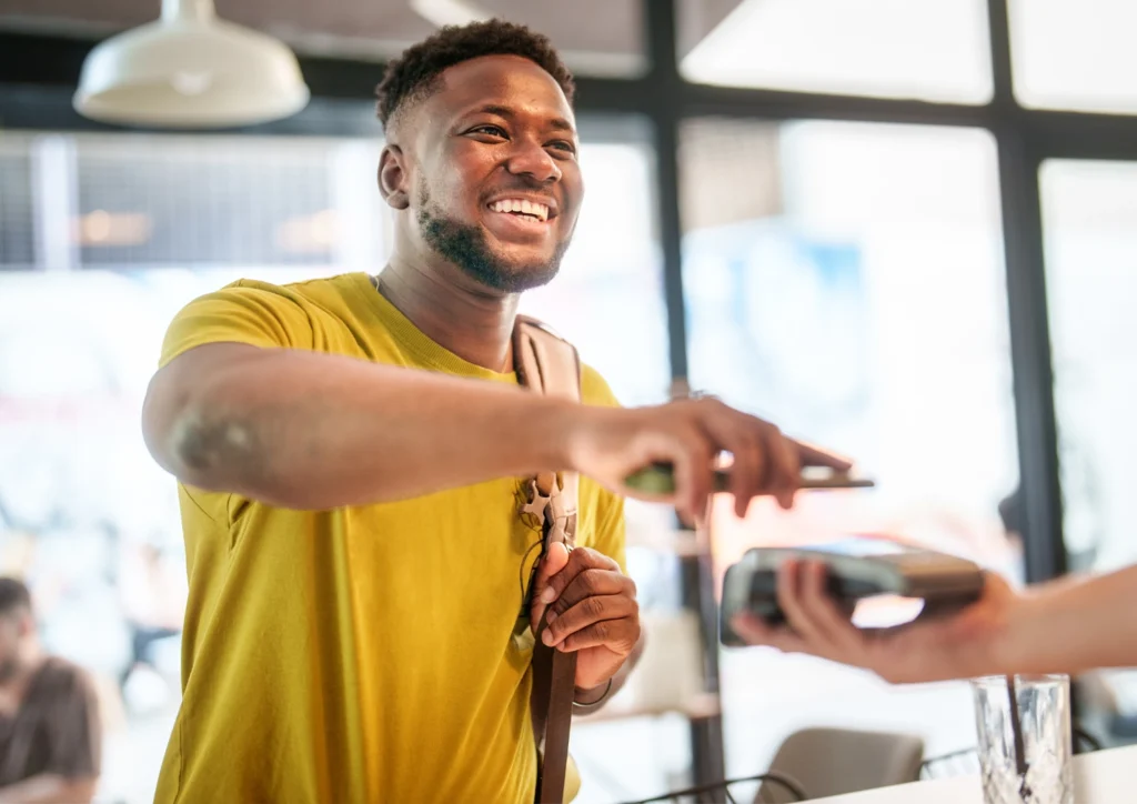 Person using payment app to make a purchase.